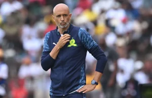 “Sundowns Is Not A Mickey Mouse Club!” Clayton Daniels Issues Warning to Coaches After Cup Disaster Mamelodi Sundowns Nedbank Cup exit 2026. Clayton Daniels Sundowns comments. Miguel Cardoso pressure Sundowns. Betway Premiership title race standings. CAF Champions League quarter-finals 2026