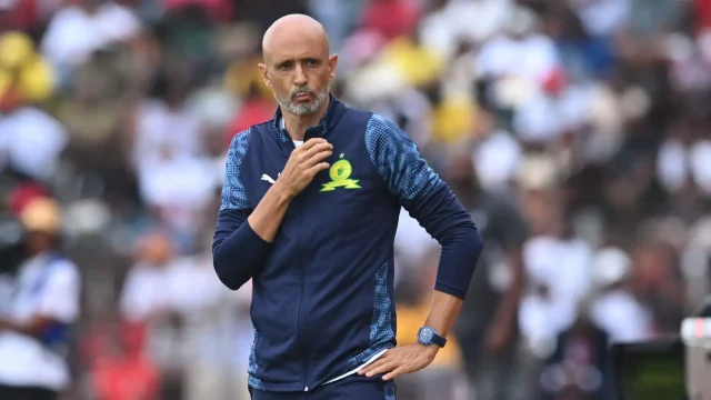Mamelodi Sundowns Nedbank Cup exit 2026. Clayton Daniels Sundowns comments. Miguel Cardoso pressure Sundowns. Betway Premiership title race standings. CAF Champions League quarter-finals 2026
