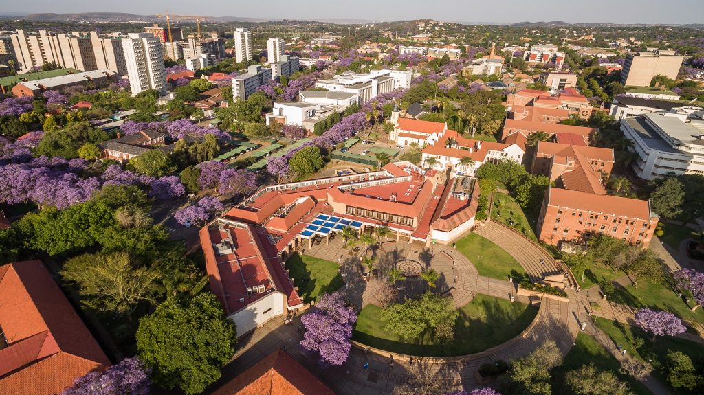 Times Higher Education Africa ranking. UCT Table Mountain. OAU architecture. UNILAG lagoon view. African campus scenery.