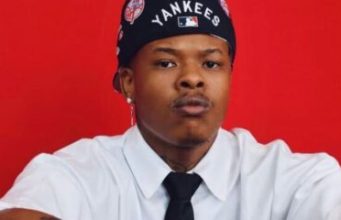 Nasty C Unveils Custom Diamond Pendant of His Son Nasty C son pendant, South African rapper jewelry, Nasty C new chain 2026, celebrity personalized jewelry, Mini Memory Pendant. Nasty C custom diamond chain